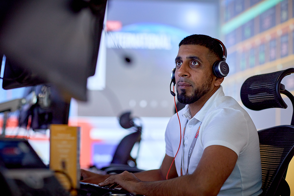 Man sitting at a computer in a support room